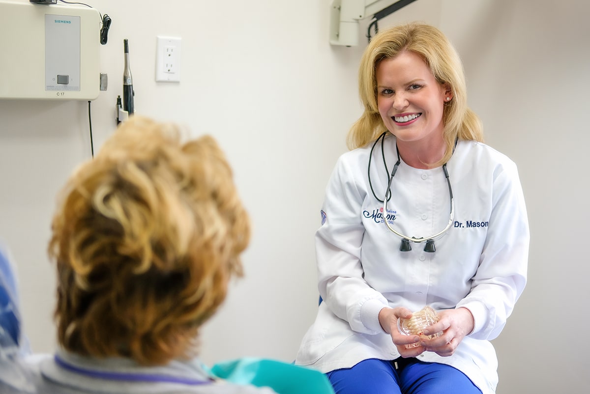 Dr. Chelsea Mason talking with a patient about treatment