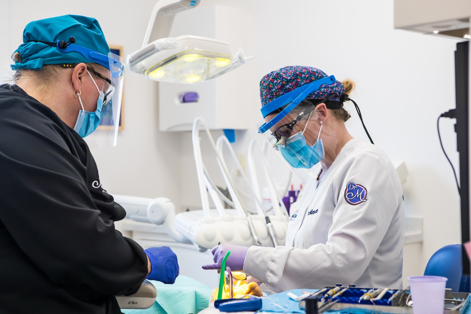 Dr. Chelsea Mason and assistant treating a patient in Bay City