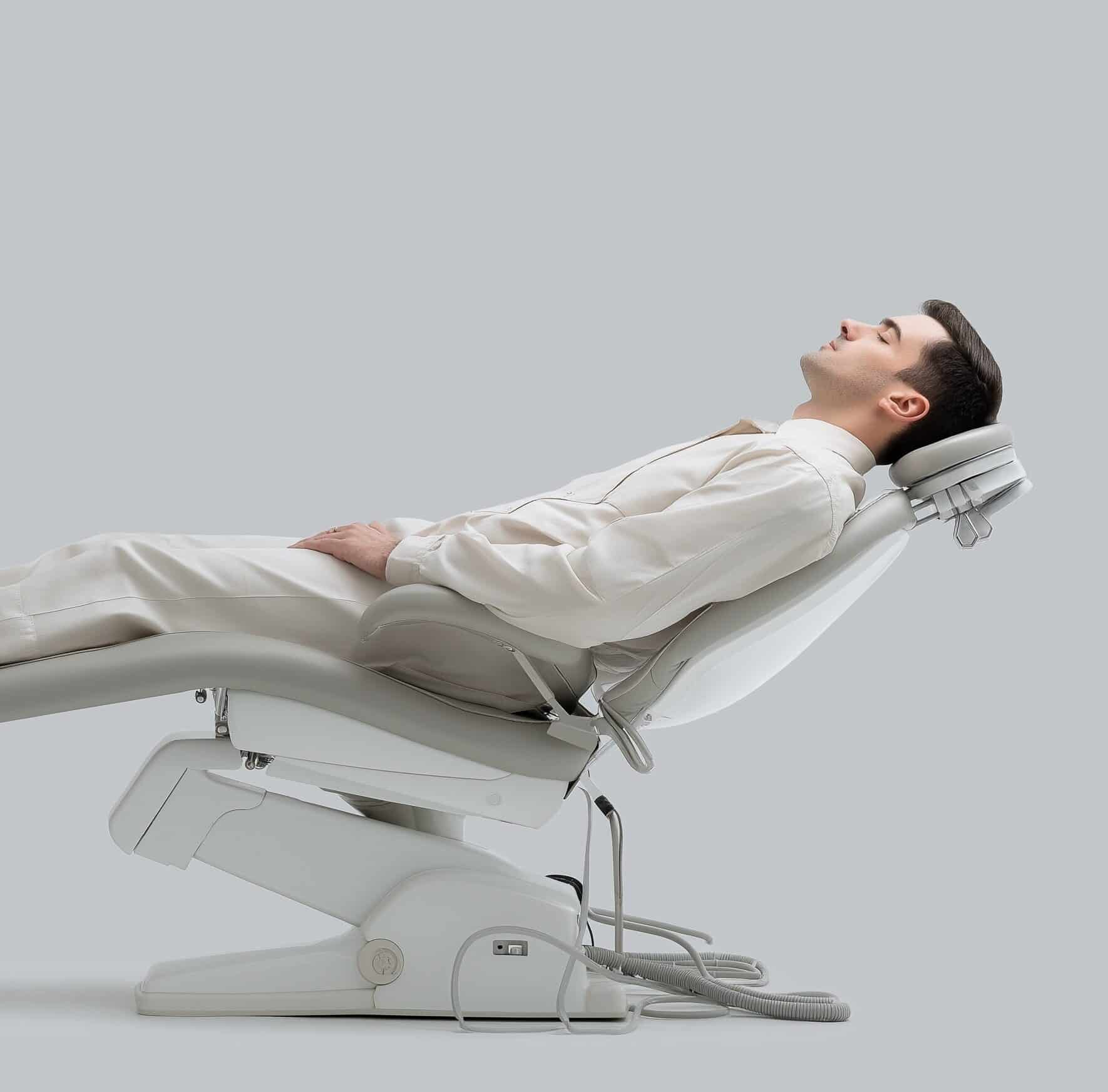 Patient reclining in a dental chair, illustrating a relaxed experience during sedation dentistry at Dr. Chelsea Mason Dental in Bay City, MI.